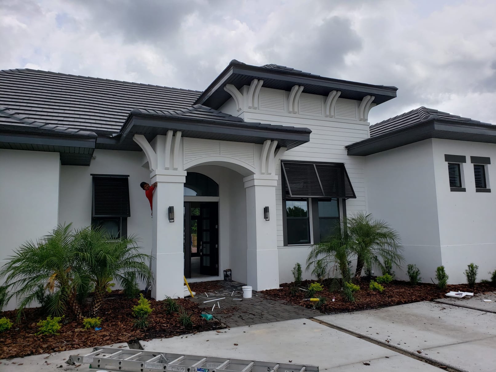 Home facade with custom foam corbels and decorative shutters