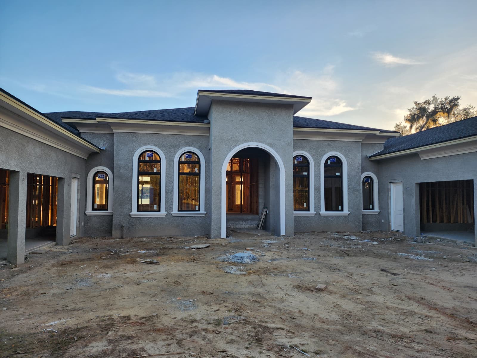New construction with foam arched window surrounds installed