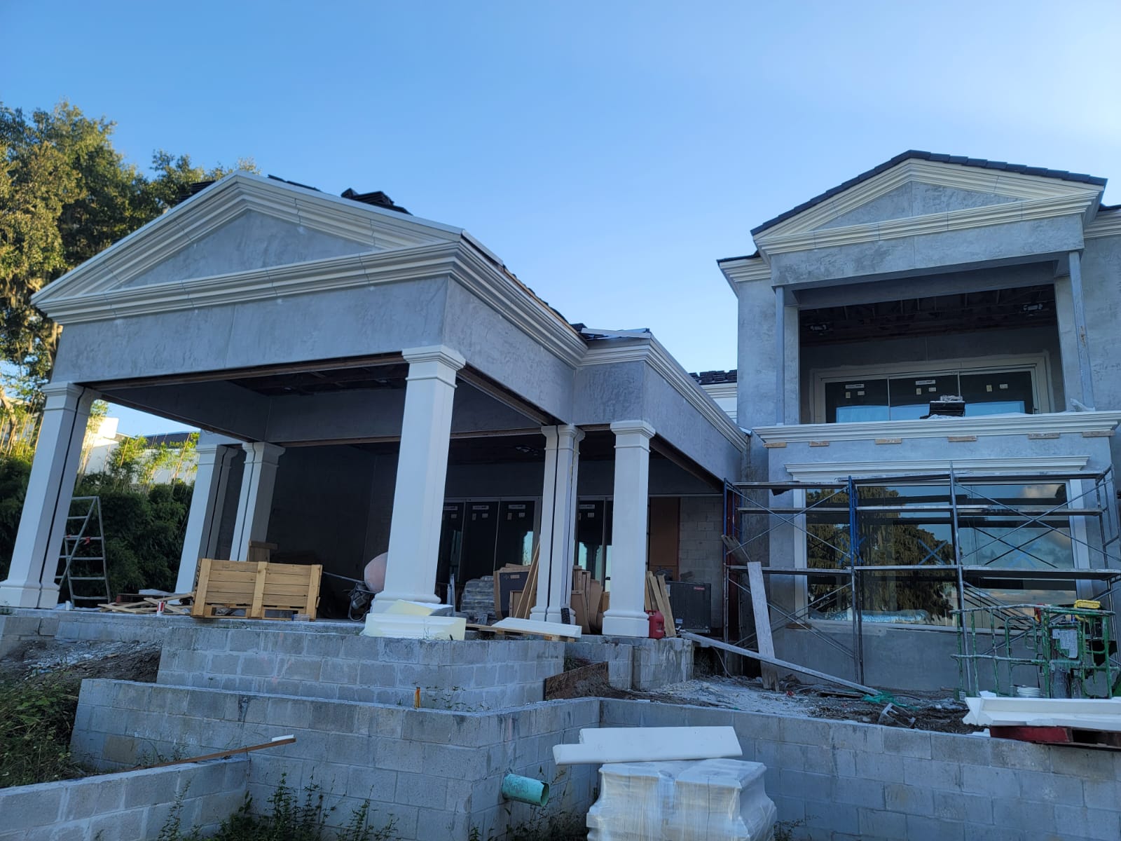 New construction home with foam columns and architectural cornice details